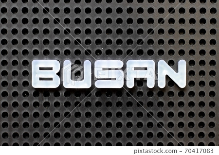 White color alphabet with word busan on black pegboard background White color alphabet with word busan on black pegboard background 70417083