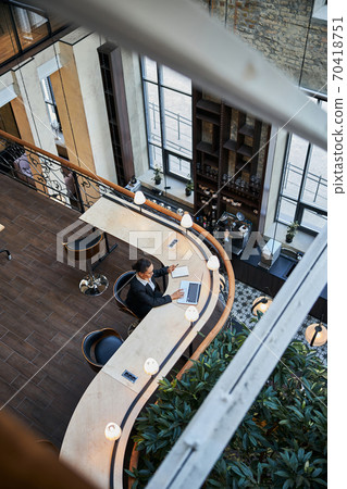 Low angle picture of serious manager that being at work 70418751