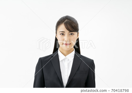 A young lady in a suit 70418798