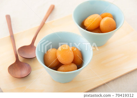 Apricot pickled in syrup Apricot pickled in syrup 70419312