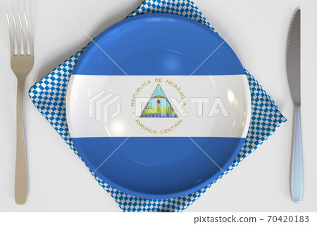Plate with flag of Nicaragua on the table, national cuisine conceptual 3d rendering 70420183