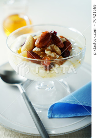 Yogurt with nuts and dried fruits 70421569