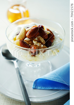 Yogurt with nuts and dried fruits Yogurt with nuts and dried fruits 70421576