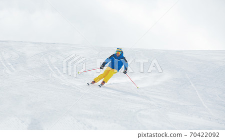 Skier on piste in high mountains Skier on piste in high mountains 70422092