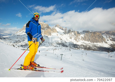 Skier stand on slope in winter mountains Skier stand on slope in winter mountains 70422097