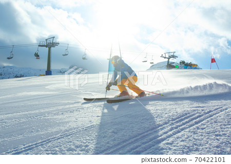 Slalom Skier attacks a gate Slalom Skier attacks a gate 70422101