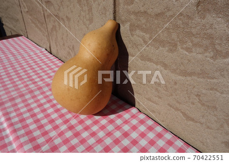 Gourd on a gingham check cloth Gourd on a gingham check cloth 70422551