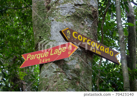 Signs on Transcarioca Trail, on Rio de Janeiro, indicating locations for Corcovado and Parque Lage 70423140