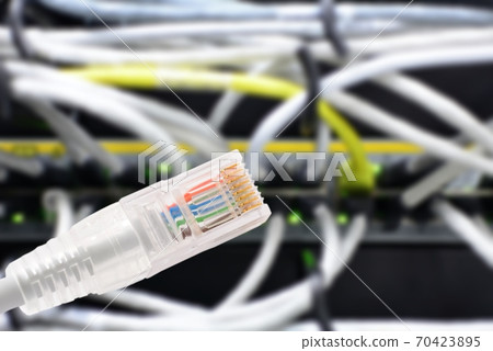 Data connection with rj45 patch cable, conceptual shot. Data connection with rj45 patch cable, conceptual shot. 70423895