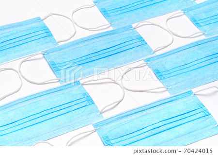 coronavirus COVID-19 pandemic concept - background made of antiviral surgical protective medical masks coronavirus COVID-19 pandemic concept - background made of antiviral surgical protective medical masks 70424015