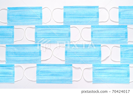 coronavirus COVID-19 pandemic concept - background made of antiviral surgical protective medical masks coronavirus COVID-19 pandemic concept - background made of antiviral surgical protective medical masks 70424017