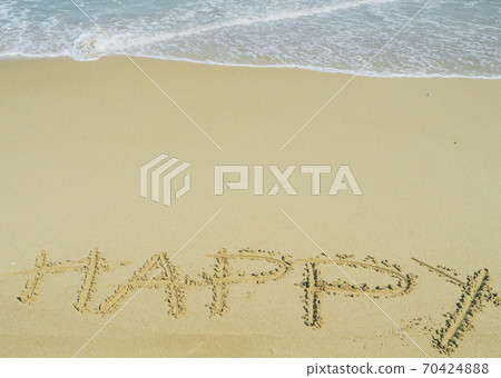 Happy wording written on sand next the sea. relaxing and enjoying summer vacation at the beach. Happy wording written on sand next the sea. relaxing and enjoying summer vacation at the beach. 70424888