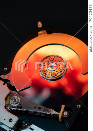 Disassembled hard drive computer, mirror effect Disassembled hard drive computer, mirror effect 70425426