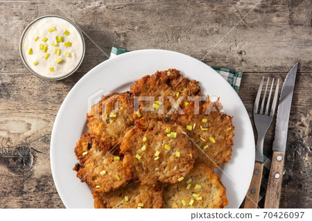 Traditional Jewish latkes or potato pancakes 70426097