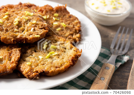 Traditional Jewish latkes or potato pancakes 70426098