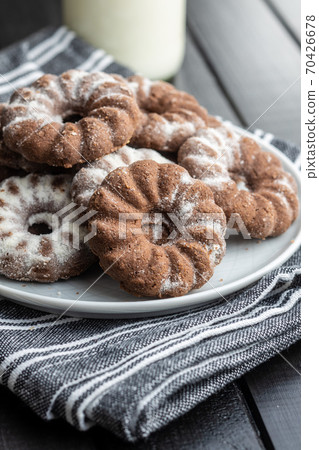 Sweet rings cookies. Biscuits with cocoa flavor on plate. 70426678
