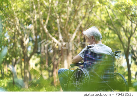 asian senior man sitting in wheelchair asian senior man sitting in wheelchair 70428533