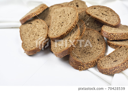 Pile of loaf bread slices 70428539
