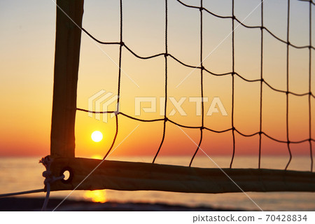 Beautiful colorful sunset over the sea and the sun shines. Orange sky. Beautiful colorful sunset over the sea and the sun shines. Orange sky. 70428834