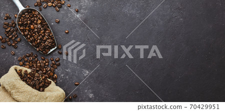 coffee beans in a sack on dark background, top view, copy space coffee beans in a sack on dark background, top view, copy space 70429951