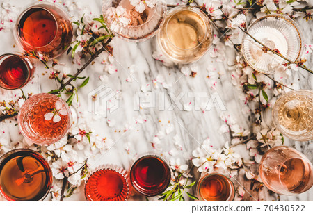 Shades of rose wine over marble background, copy 70430522