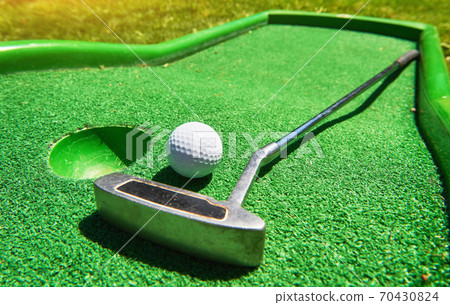 Golf ball and Golf Club on Artificial Grass Golf ball and Golf Club on Artificial Grass 70430824