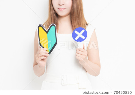 A young woman with a beginner's mark A young woman with a beginner's mark 70430850