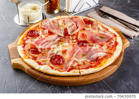 Pizza with salami and prosciutto Pizza with salami and prosciutto 70430970
