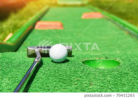 Golf ball and Golf Club on Artificial Grass Golf ball and Golf Club on Artificial Grass 70431263