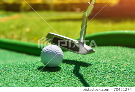 Golf ball and Golf Club on Artificial Grass Golf ball and Golf Club on Artificial Grass 70431274