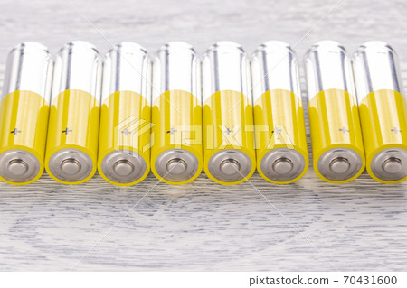 AA batteries on an old white wooden table. Energy concept AA batteries on an old white wooden table. Energy concept 70431600
