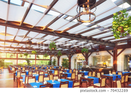 Empty served restaurant table waiting for visitors is located on the beach. Amara Dolce Vita Luxury Hotel. Resort. Tekirova-Kemer Empty served restaurant table waiting for visitors is located on the beach. Amara Dolce Vita Luxury Hotel. Resort. Tekirova-Kemer 70432289