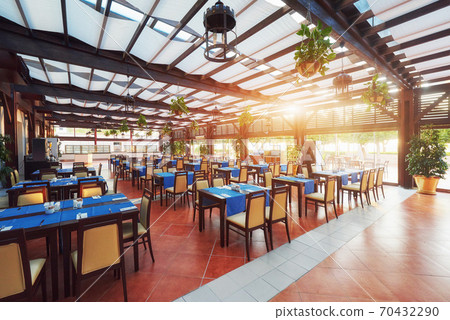 Empty served restaurant table waiting for visitors is located on the beach. Amara Dolce Vita Luxury Hotel. Resort. Tekirova-Kemer Empty served restaurant table waiting for visitors is located on the beach. Amara Dolce Vita Luxury Hotel. Resort. Tekirova-Kemer 70432290