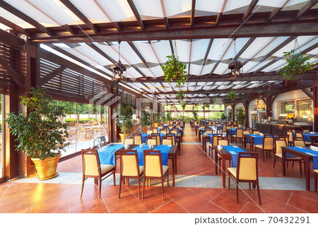 Empty served restaurant table waiting for visitors is located on the beach. Amara Dolce Vita Luxury Hotel. Resort. Tekirova-Kemer Empty served restaurant table waiting for visitors is located on the beach. Amara Dolce Vita Luxury Hotel. Resort. Tekirova-Kemer 70432291