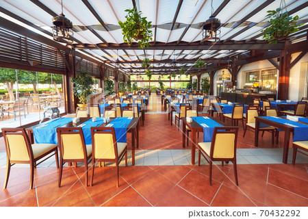 Empty served restaurant table waiting for visitors is located on the beach. Amara Dolce Vita Luxury Hotel. Resort. Tekirova-Kemer Empty served restaurant table waiting for visitors is located on the beach. Amara Dolce Vita Luxury Hotel. Resort. Tekirova-Kemer 70432292