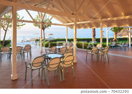 Empty served restaurant table waiting for visitors is located on the beach. Amara Dolce Vita Luxury Hotel. Resort. Tekirova-Kemer Empty served restaurant table waiting for visitors is located on the beach. Amara Dolce Vita Luxury Hotel. Resort. Tekirova-Kemer 70432293