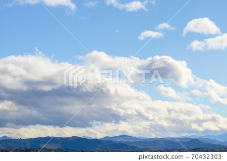 Mountain range in clear weather in contrasting rain clouds before the rain. Beautiful picturesque landscape Mountain range in clear weather in contrasting rain clouds before the rain. Beautiful picturesque landscape 70432303