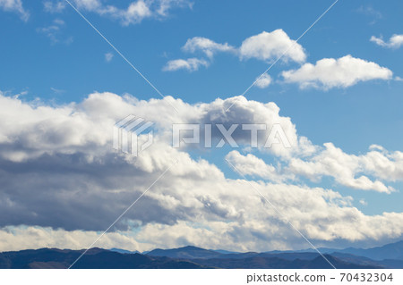Mountain range in clear weather in contrasting rain clouds before the rain. Beautiful picturesque landscape, travel Mountain range in clear weather in contrasting rain clouds before the rain. Beautiful picturesque landscape, travel 70432304