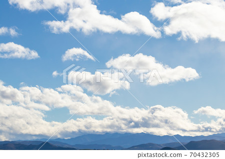 Mountain range in clear weather in contrasting rain clouds before the rain 70432305
