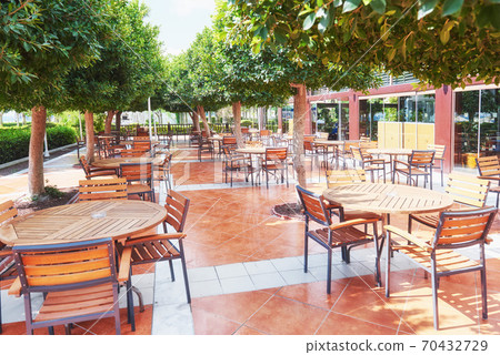 Empty served restaurant table waiting for visitors is located on the beach. Amara Dolce Vita Luxury Hotel. Resort. Tekirova-Kemer Empty served restaurant table waiting for visitors is located on the beach. Amara Dolce Vita Luxury Hotel. Resort. Tekirova-Kemer 70432729