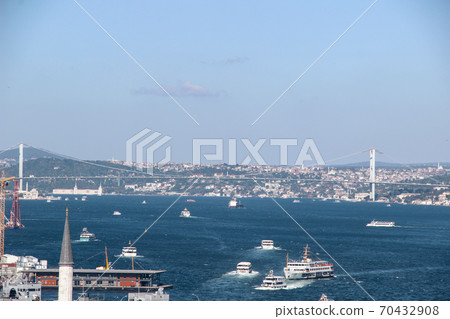 Mosque minarets and Bosphorus bridge in Istanbul in Turkey and the sea of Marmara on background 70432908