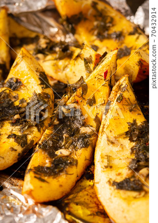 Baked pumpkin with dill and parsley, spices 70432914