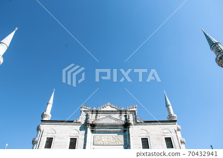Mosque minarets and Bosphorus bridge in Istanbul in Turkey and the sea of Marmara on background Mosque minarets and Bosphorus bridge in Istanbul in Turkey and the sea of Marmara on background 70432941