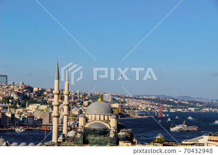 Mosque minarets and Bosphorus bridge in Istanbul in Turkey and the sea of Marmara on background Mosque minarets and Bosphorus bridge in Istanbul in Turkey and the sea of Marmara on background 70432948
