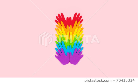 Tolerance, kindness, cooperative, friendship, charity humanitarian aid day concept. Many rainbow color palm hands on pink background with copy space 70433334