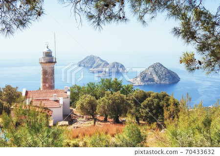 Lighthouse Gelidonya Peninsula in spring. Beautiful landscapes outdoors in Turkey and Asia. The landscape in the Mediterranean. Lighthouse Gelidonya Peninsula in spring. Beautiful landscapes outdoors in Turkey and Asia. The landscape in the Mediterranean. 70433632