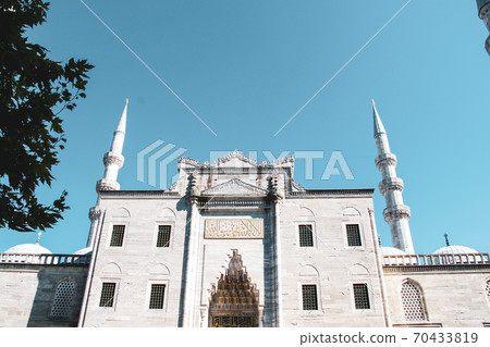 Minaret and dome of Suleymanie Mosque with Istanbul city background in Istanbul in Turkey Minaret and dome of Suleymanie Mosque with Istanbul city background in Istanbul in Turkey 70433819