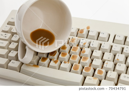 Coffee and damaged computer keyboard Coffee and damaged computer keyboard 70434791