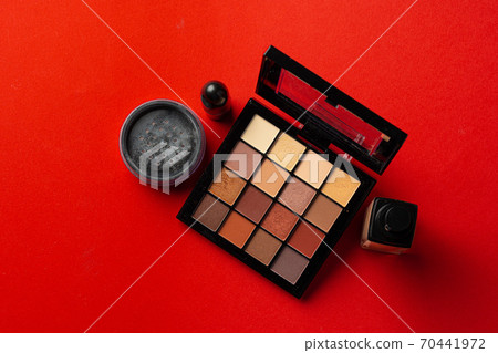 Set of cosmetics isolated over red background. 70441972