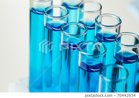 Laboratory test tubes with blue liquid close up 70442654